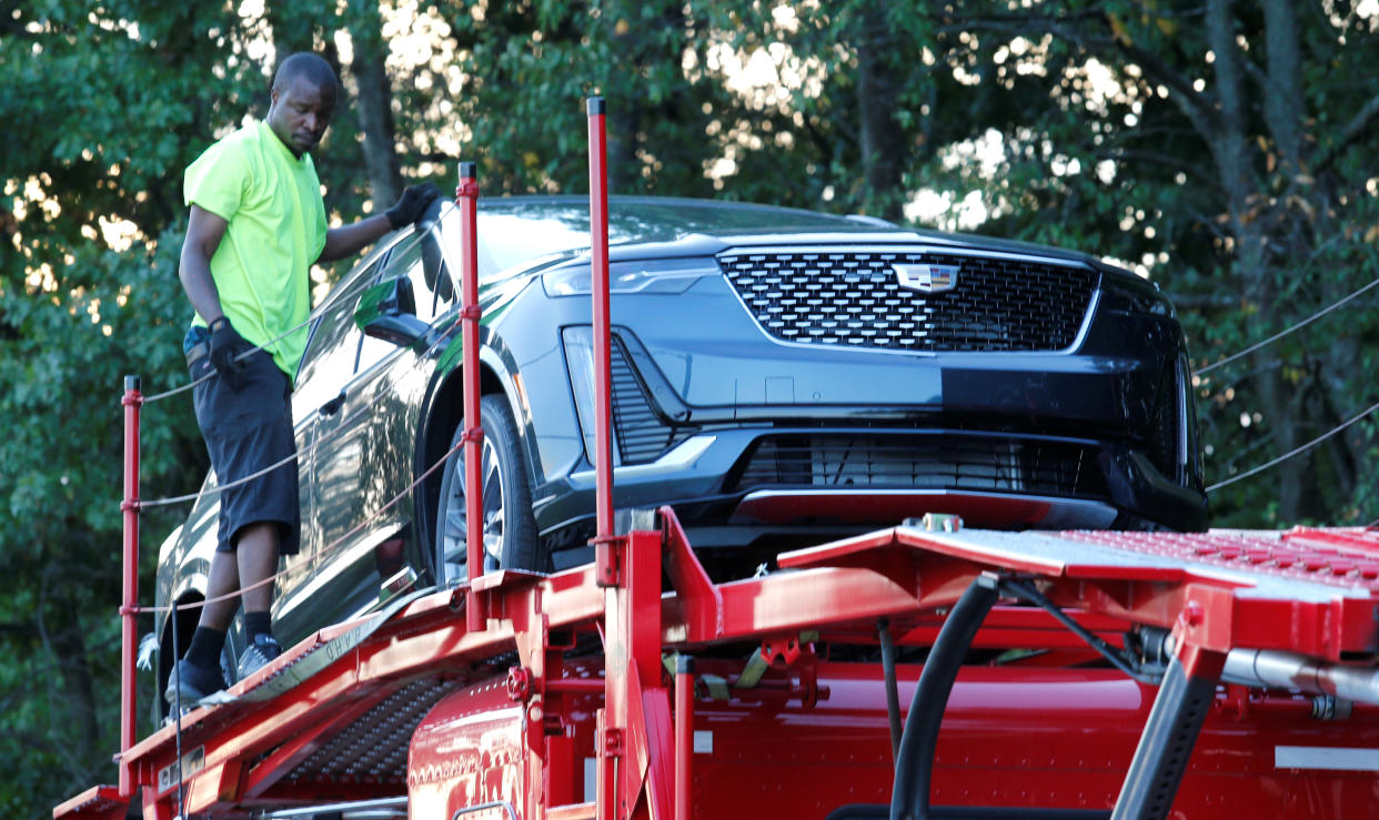 A car hauler delivers a Cadillac XT6 vehicles to La Fontaine Cadillac dealership in Highland, Michigan, U.S. September 18, 2019. REUTERS/Rebecca Cook