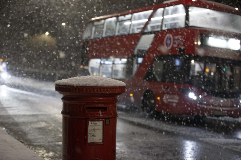 FTSE 100 LONDON, UNITED KINGDOM - DECEMBER 11: A view of the snow covered mailbox during snowfall in London, United Kingdom on December 11, 2022. Officials announced that the most effective snowfall since 2013 is expected across the country. (Photo by Rasid Necati Aslim/Anadolu Agency via Getty Images)