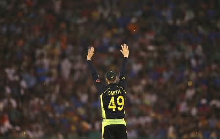 Cricket - India v Australia - World Twenty20 cricket tournament - Mohali, India - 27/03/2016. Australia's captain Steven Smith makes field placings. REUTERS/Adnan Abidi