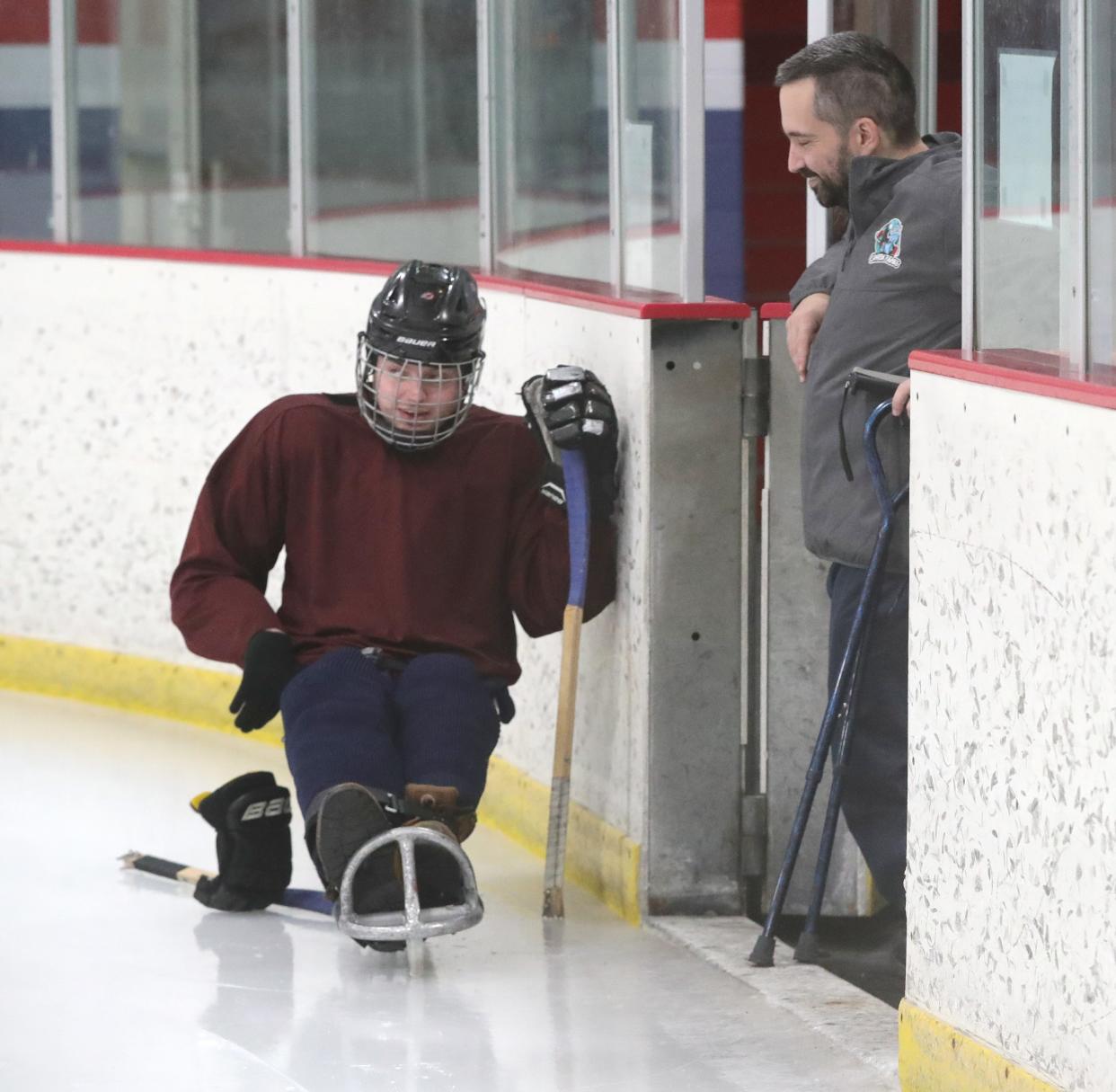 Canton Tuskies player Patrick Brennan, left, talks with teammate Brian Brately during a break at practice at the Center Ice Sports Complex, Monday, Feb. 19, 2024.