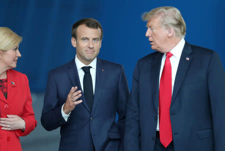 France's President Emmanuel Macron and U.S. President Donald Trump talk at NATO headquarters in Brussels, Belgium July 11, 2018. Tatyana Zenkovich/Pool via REUTERS?