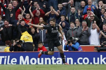 Liverpool's Steven Gerrard celebrates after scoring their first goal. Action Images via Reuters / Ed Sykes