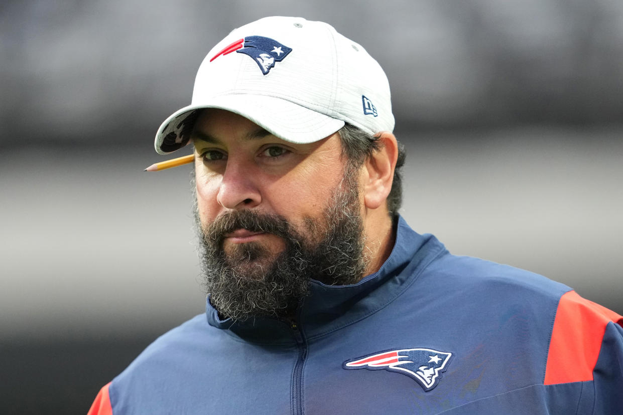 LAS VEGAS, NEVADA - AUGUST 26:   Senior football advisor Matt Patricia of the New England Patriots walks onto the field during warmups before a preseason game against the Las Vegas Raiders at Allegiant Stadium on August 26, 2022 in Las Vegas, Nevada. (Photo by Chris Unger/Getty Images)