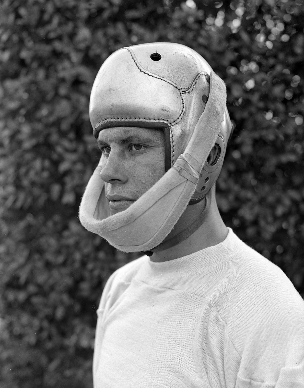 Frank Sinkwich, star left halfback of the University of Georgia, seen Oct. 24, 1941, wears a special brace to protect his jaw, which was broken in a game with North Carolina earlier in the season.  (AP Photo)
