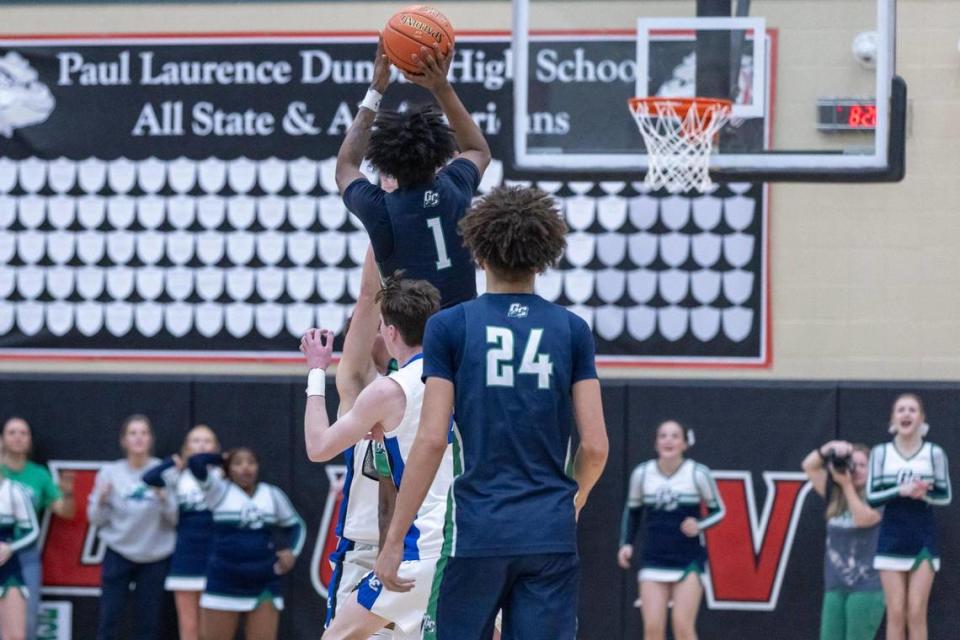 Great Crossing’s Vince Dawson (1) puts up the game-winning three-point shot just before the buzzer on Tuesday night.