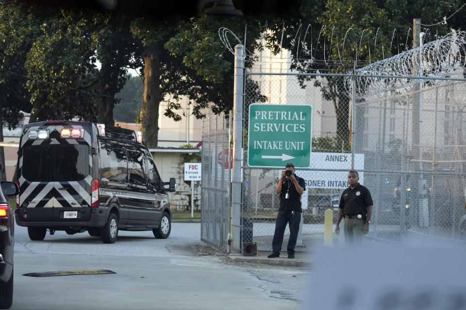 The motorcade of former President Donald Trump arrives at the Fulton County Jail, Thursday, Aug. 24, 2023, in Atlanta. (AP Photo/Alex Brandon)