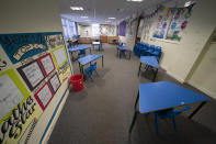 A classroom with safely spaced desks laid out before the possible reopening of Lostock Hall Primary school in Poynton near Manchester, England, Wednesday May 20, 2020. Since March 20, the coronavirus has forced British schools to close to all but a small number of key workers' children and those under social care. The government wants children to start returning to primary schools in stages from June 1. Those going back first include the youngest — ages 4 to 6. (AP Photo/Jon Super)