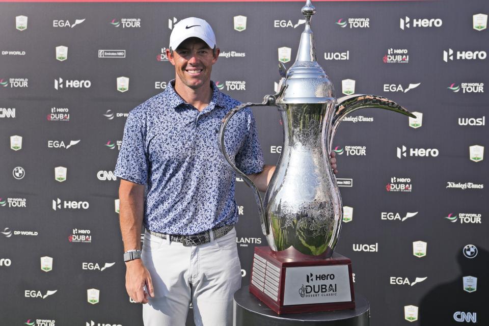 Rory McIlroy of Northern Ireland poses with his trophy after he won the the Dubai Desert Classic, in Dubai, United Arab Emirates, Monday, Jan. 30, 2023. (AP Photo/Kamran Jebreili)