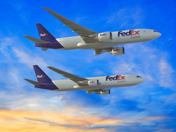 A rendering of a 767F and a 777F flying side-by-side in the FedEx livery