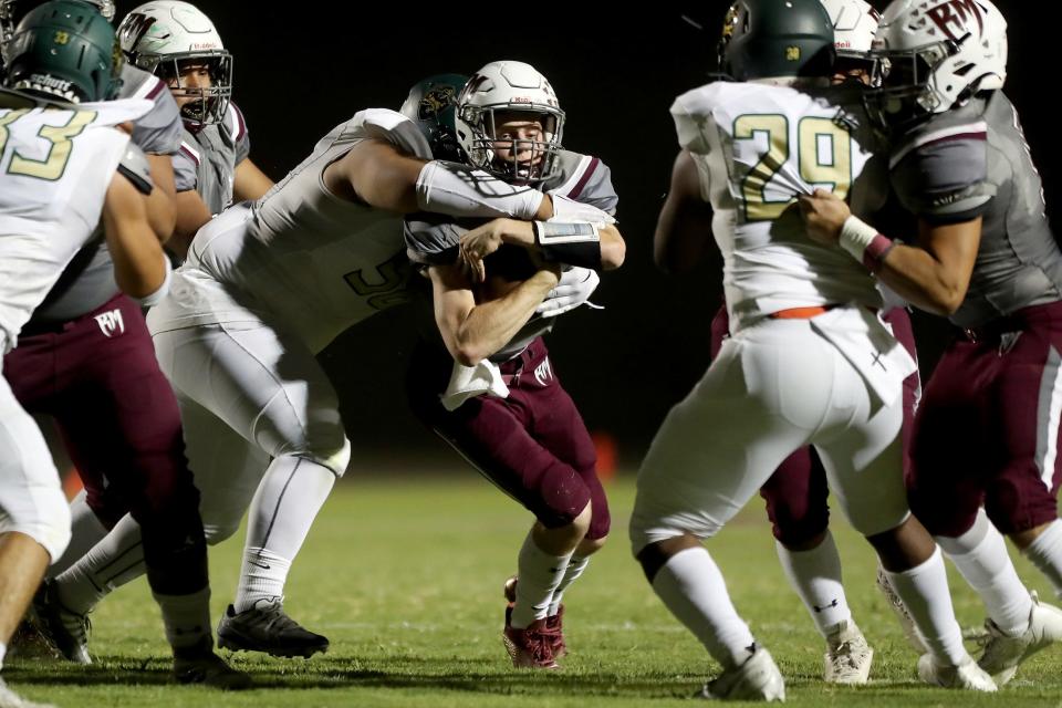 Rancho Mirage quarterback Luke Hershberger runs for a first down during the game against Tahquitz in Rancho Mirage, Calif., on August 31, 2023.