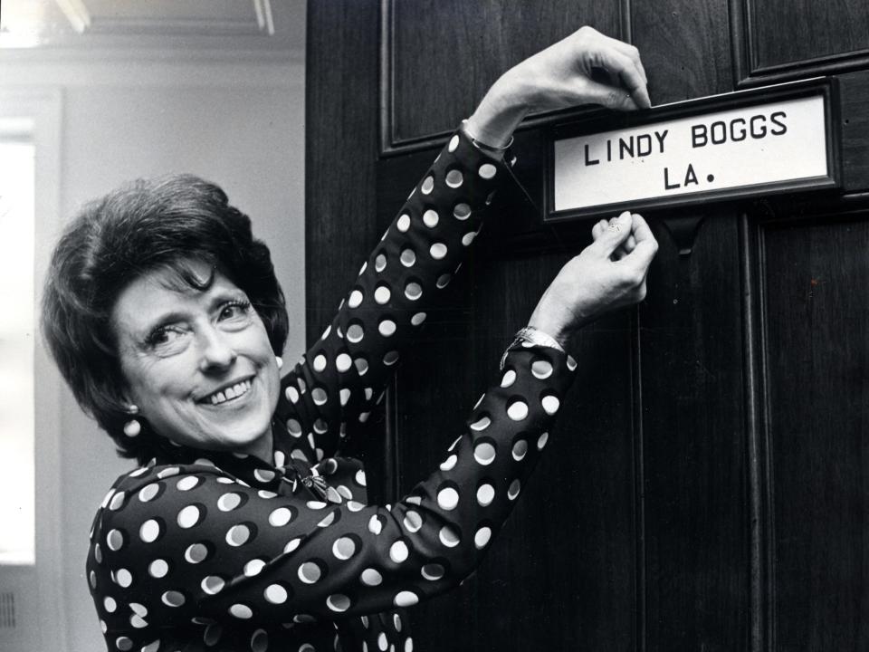 Lindy Boggs holds a sign on the door of her Congressional office reading "Lindy Boggs, L.A."