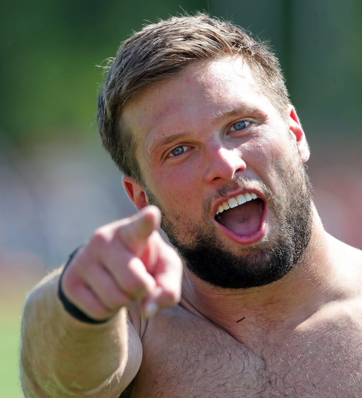 Cleveland Browns defensive end Chase Winovich goofs around as he comes off the field after the NFL football team's football training camp in Berea on Wednesday.