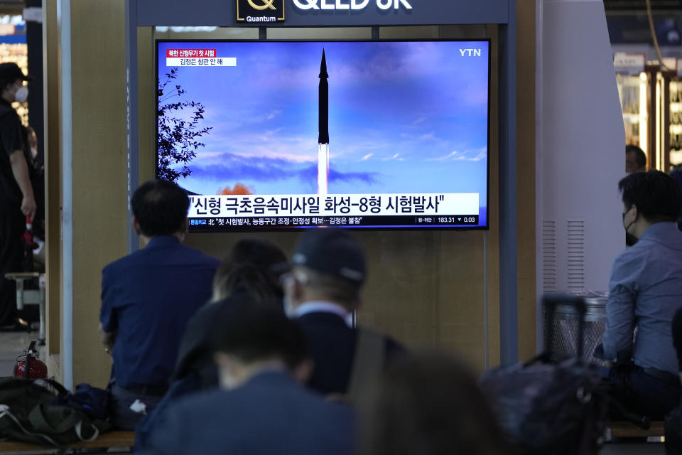 People watch a TV screen showing a news program reporting about North Korea's missile launch at a train station in Seoul, South Korea, Wednesday, Sept. 29, 2021. North Korea said Wednesday it successfully tested a new hypersonic missile it implied was being developed as nuclear capable, as it continues to expand its military capabilities and pressure Washington and Seoul over long-stalled negotiations over its nuclear weapons. The Korean letters read: "Test a new hypersonic missile." (AP Photo/Lee Jin-man)