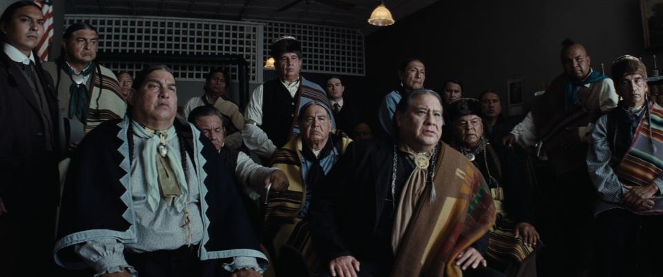 In front, Okahomans and Osage Nation citizens Everett Waller, left, and Yancey Red Corn appear in a scene from the movie "Killers of the Flower Moon."