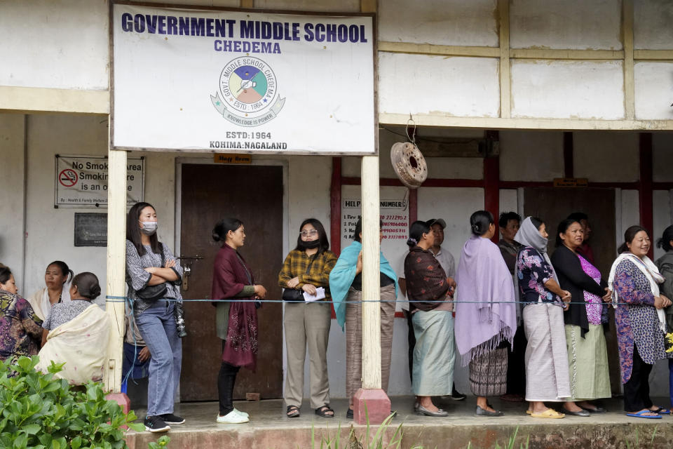 Angami Nagas stand in a queue to cast their votes in Chedema village, in the northeastern Indian state of Nagaland, Friday, April 19, 2024. (AP Photo/Yirmiyan Arthur)