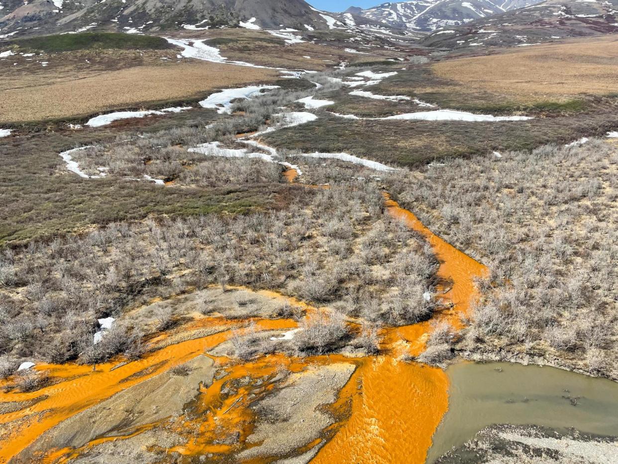 <span>Orange streams in the Brooks Range of northern Alaska.</span><span>Photograph: Josh Koch/USGS</span>