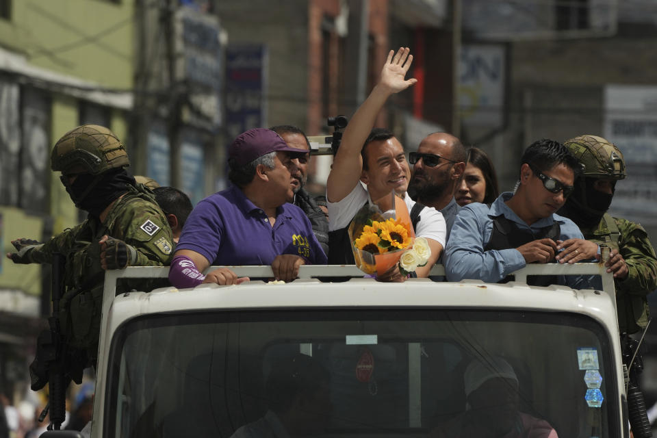 Protected by soldiers and police, Presidential candidate Daniel Noboa, of the National Democratic Action Alliance political party, greets supporters during a rally in Quito, Ecuador, Wednesday, Oct. 11, 2023. (AP Photo/Dolores Ochoa)
