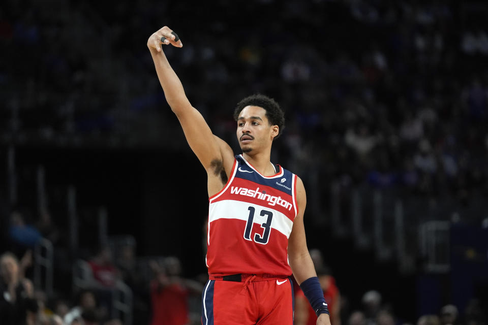 Washington Wizards guard Jordan Poole (13) reacts to his three-point basket against the Detroit Pistons in the second half of an NBA basketball game in Detroit, Saturday, Jan. 27, 2024. (AP Photo/Paul Sancya)