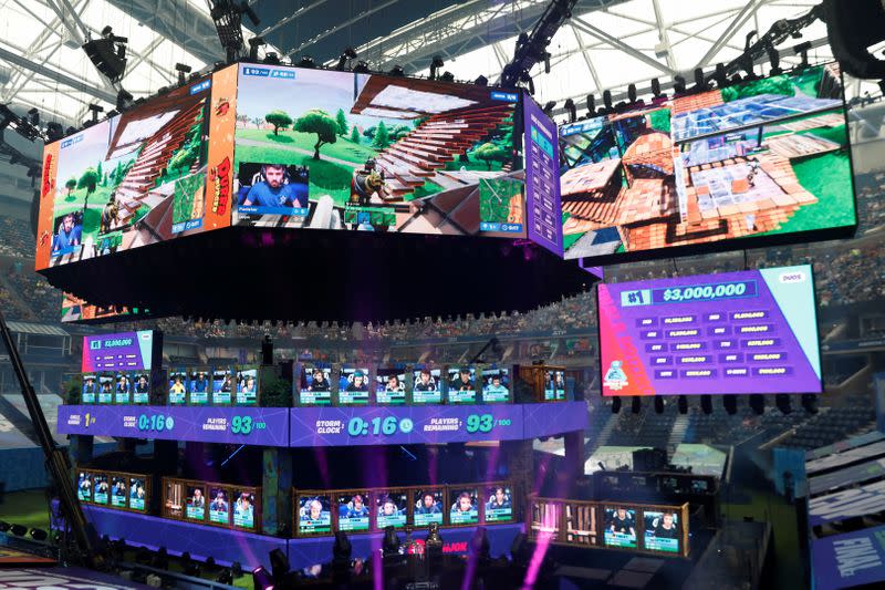 FILE PHOTO: Contestants compete during the Fortnite World Cup Duos Finals at Flushing Meadows Arthur Ashe stadium in the Queens borough of New York