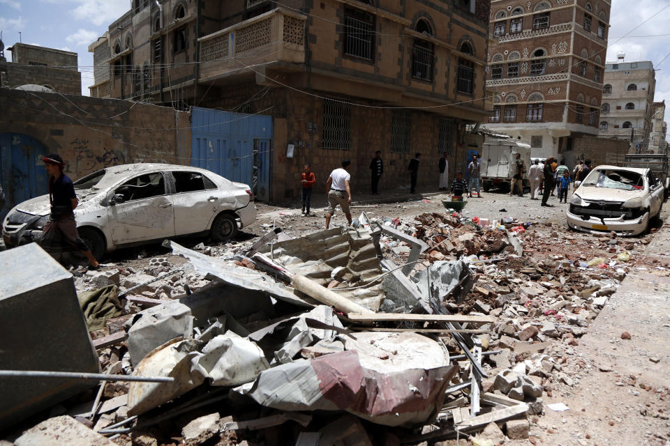 Yemeni people inspect houses hit by airstrikes carried out by warplanes of the Saudi-led coalition on May 16, 2019 in Sana'a, Yemen. (Photo: Mohammed Hamoud/Getty Images)