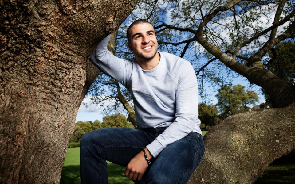 Dizzy heights: Adam Gemili, who won a gold medal at the World Athletics Championships this year, is pictured near Dartford Harriers Athletic Club in his home town - Rii Schroer