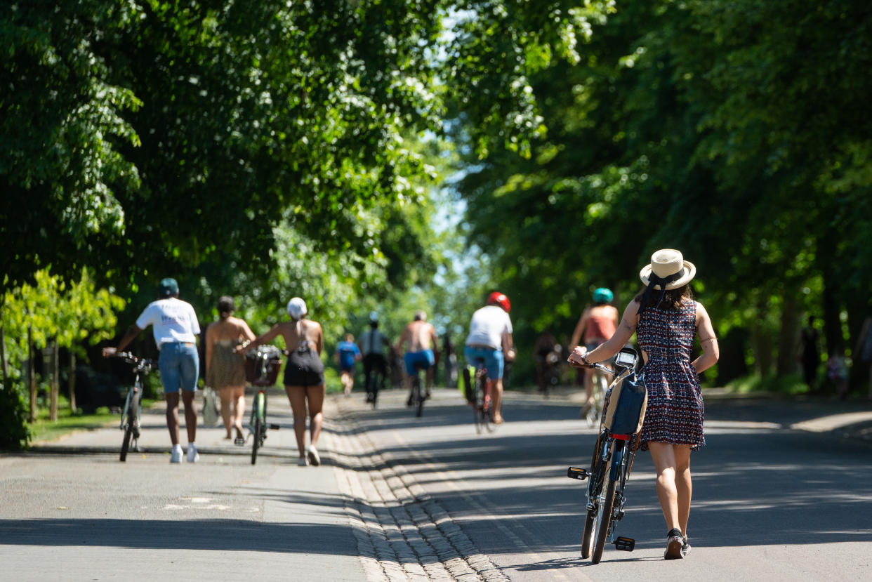 People enjoy the hot weather in Greenwich Park, London, flocking to parks and beaches with lockdown measures eased. (Photo by Dominic Lipinski/PA Images via Getty Images)