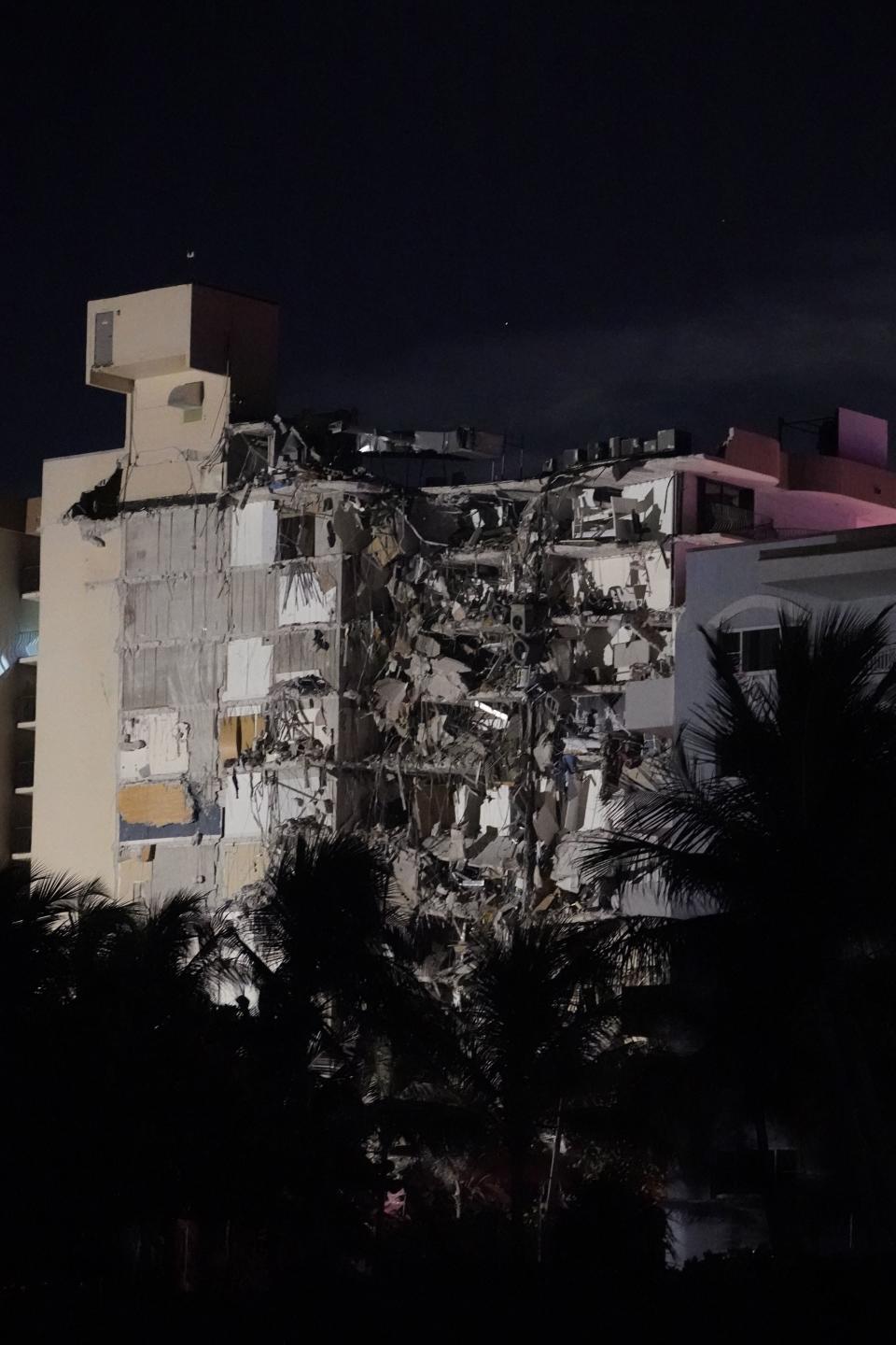 A partial collapsed building is seen early Thursday, June 24, 2021, in Surfside area of Miami, Fla.