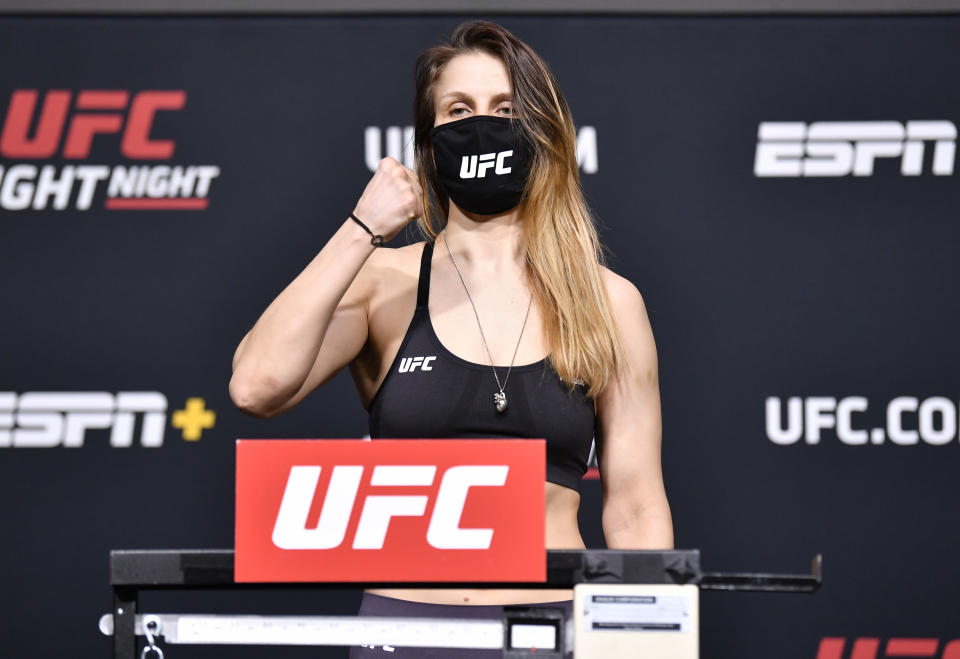 Julija Stoliarenko of Lithuania poses on the scale during the UFC weigh-in