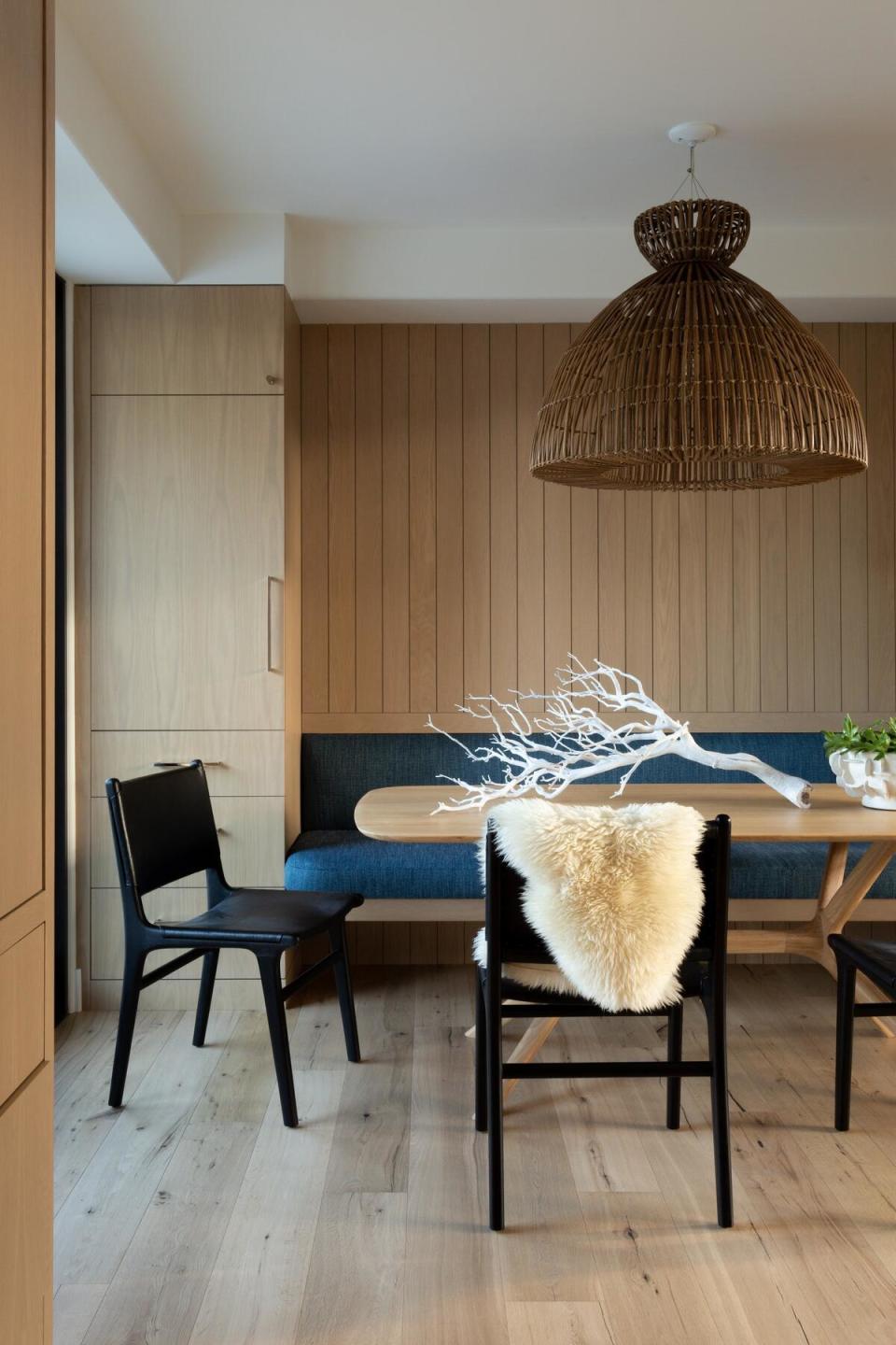 A cozy dining space with a built-in bench designed by Lark + Palm