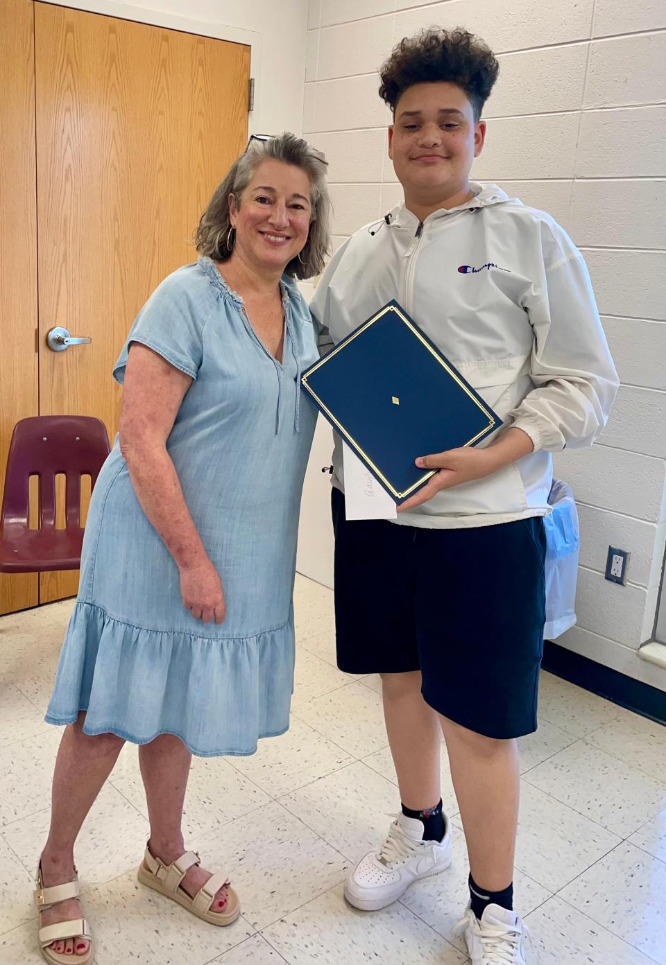 Aary’s White receiving his Supporter Award from Annette Flynn, Oak Ridge, June 2024.