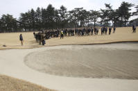 Journalists gather around Japanese golf player Tsuneyuki Nakajima during a media tour of Kasumigaseki Country Club golf course, one of the venues of the Tokyo 2020 Olympics, in Kawagoe near Tokyo, Monday, Feb. 25, 2019. Golf returned to the Olympic three years ago in Rio de Janeiro. But few play golf in Brazil. It should be different at the Tokyo Olympics. (AP Photo/Koji Sasahara)