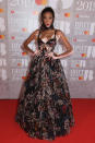 <p>Model Winnie Harlow showed the music industry how it’s done on the red carpet in a sheer floral dress and matching headscarf. <em>[Photo: Getty]</em> </p>