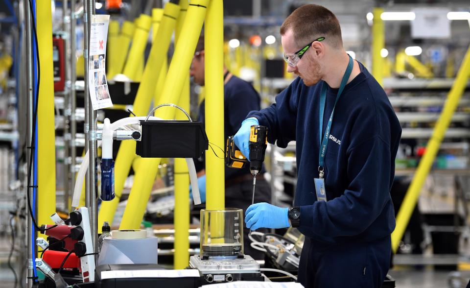 Airbus employees work on the assembly line to produce ventilators at the Advanced Manufacturing Research Centre (AMRC Cymru) in Broughton, north Wales on April 30, 2020. - Airbus have joined forces with Siemens, Ford and McLaren to manufacture ventilators with the aim of producing 1500 a week. (Photo by Paul ELLIS / AFP) (Photo by PAUL ELLIS/AFP via Getty Images)