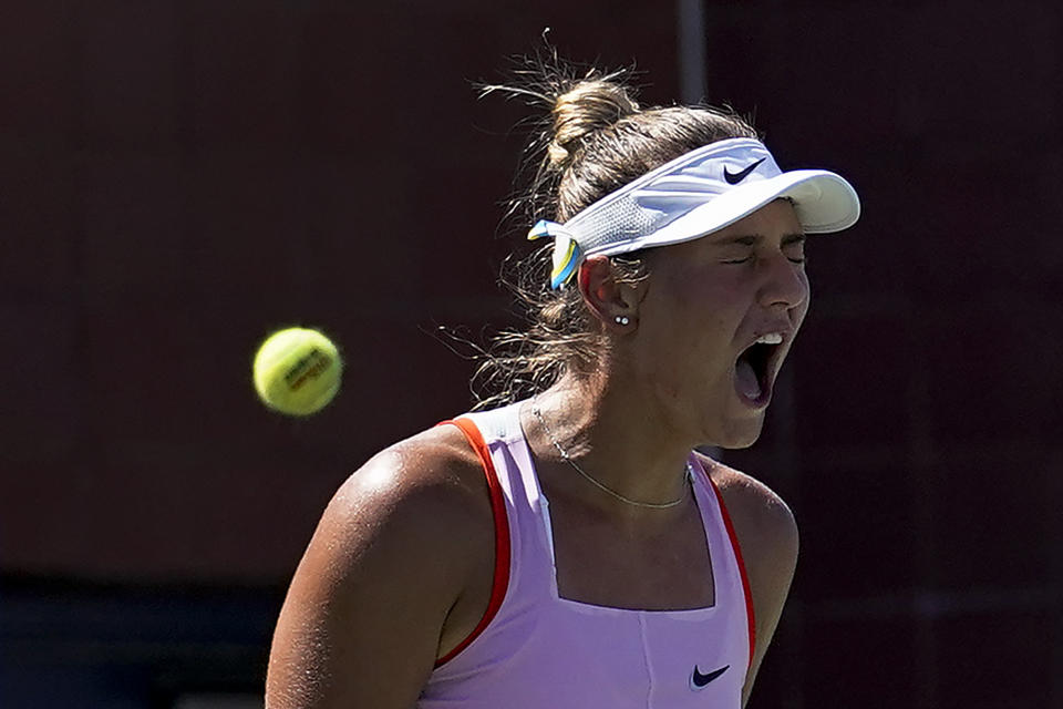 Marta Kostyuk, of Ukraine, reacts during a match against Victoria Azarenka, of Belarus, during the second round of the U.S. Open tennis championships, Thursday, Sept. 1, 2022, in New York. (AP Photo/Julia Nikhinson)