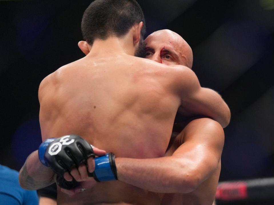 Makhachev consoles Volkanovski after their fight, the main event of UFC 294 (AP)