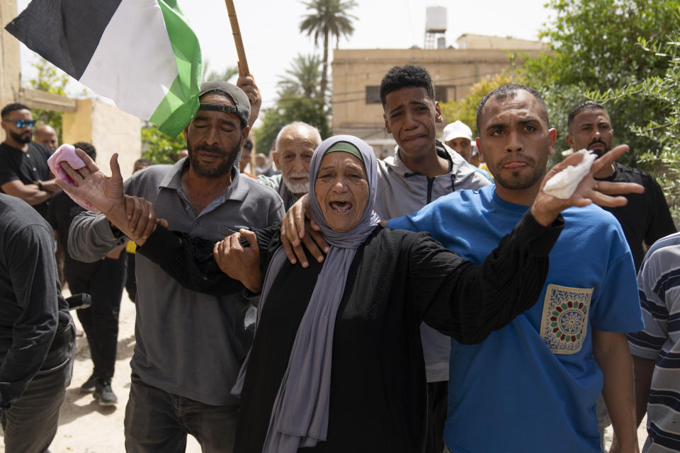 Mother of Palestinian Shadi Jalaita, 44, cries upon the arrival of her son's body at the family house for the last look during his funeral in the West Bank city of Jericho Tuesday, April 23, 2024. Israeli forces shot dead a Palestinian man early Tuesday in the West Bank city of Jericho, an eyewitness and Palestinian officials said. The Palestinian Health Ministry said he suffered a fatal gunshot wound to the chest. (AP Photo/Nasser Nasser)