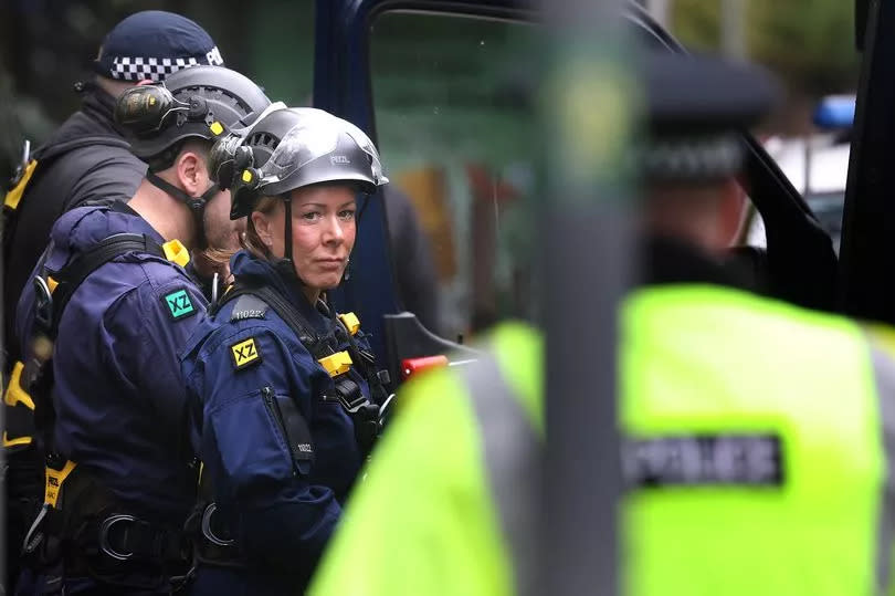 Police during the search at Kersal Dale. A hundred officers were deployed over 12 days.