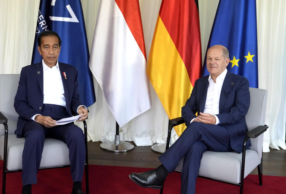 German Chancellor Olaf Scholz, right, poses with Indonesia's President Joko Widodo during a meeting on the sidelines of the G7 summit at Castle Elmau in Kruen, near Garmisch-Partenkirchen, Germany, on Monday, June 27, 2022. The Group of Seven leading economic powers are meeting in Germany for their annual gathering Sunday through Tuesday. (AP Photo/Markus Schreiber, Pool)