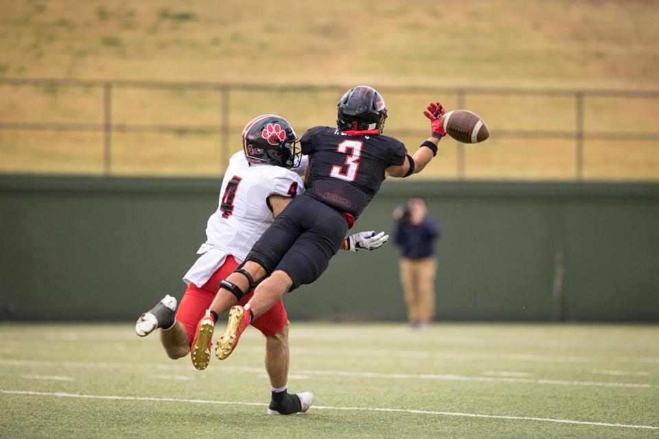 Amarillo Tascosa Rebel’s Tayden Barnes (3)  deflects a pass during a Region I-5A Division I semifinal game against the Colleyville Heritage Panthers at Memorial Stadium in Wichita Falls, TX.