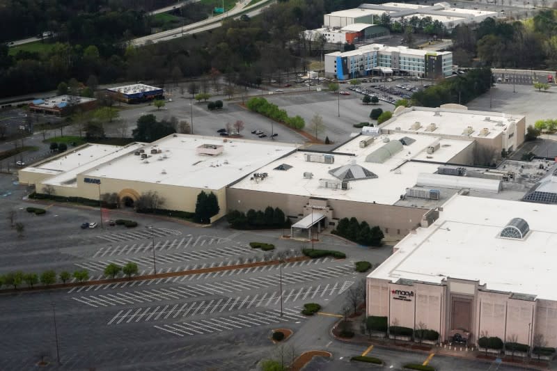 An empty mall parking lot is seen in Kennesaw