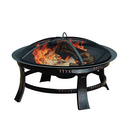 <p><strong>Pleasant Hearth</strong></p><p>amazon.com</p><p><strong>$74.76</strong></p><p><a href="https://www.amazon.com/dp/B00D6D3YK6?tag=syn-yahoo-20&ascsubtag=%5Bartid%7C10054.g.40107431%5Bsrc%7Cyahoo-us" rel="nofollow noopener" target="_blank" data-ylk="slk:Shop Now;elm:context_link;itc:0;sec:content-canvas" class="link ">Shop Now</a></p><p><strong>Key Specs</strong><br></p><ul><li><strong>Dimensions:</strong> 30 x 30 x 17.32 inches</li><li><strong>Fuel Type: </strong>Wood</li><li><strong>Exterior Material: </strong>Alloy steel</li></ul><p>At nearly 50 percent off—just over $60 on sale—this wood-burning fire pit is the best deal roundup.</p><p>It's compact enough for a small outdoor space, and, thanks to its low-to-the-ground design, can be set in the center of chairs in the backyard or on a more expansive patio. </p><p>It features an oil-rubbed bronze finish and comes with a fire poker to lift the spark screen, plus there's an ash catcher at the base of the fire bowl—a handy extra not commonly found it fire pits at this price point. There's also a fire poker included to lift the spark screen cover. </p>