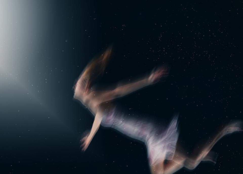 A person floating in space