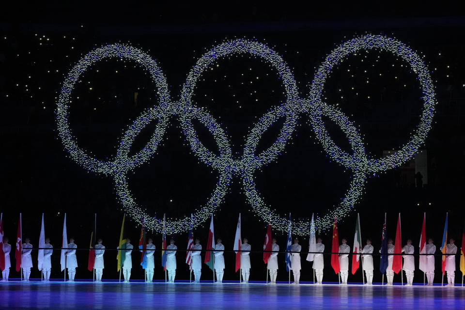 FILE - The Olympic rings are displayed during the closing ceremony of the 2022 Winter Olympics, on Feb. 20, 2022, in Beijing. A small band or protesters gathered Sunday, June 12, in central Tokyo and in the northern city of Sapporo to oppose Japan’s overtures to hold the 2030 Winter Olympics.(AP Photo/Natacha Pisarenko, File)