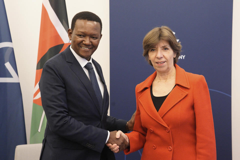 French Foreign Minister Catherine Colonna, left, and Kenya's Foreign Minister, Alfred Mutua, right, shake hands during a bilateral meeting at a G7 Foreign Ministers Meeting at the City Hall in Muenster, Germany, Nov. 4, 2022. (Bernd Lauter/Pool Photo via AP)