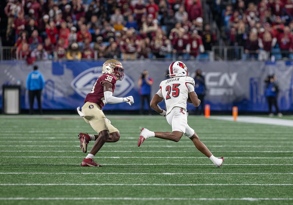 Louisville's Jawhar Jordan (25) found some room to run during first half action as the Louisville Cardinals faced off against the Florida State Seminoles in the 2023 ACC Championship game at Bank of America Field in Charlotte, NC, on Saturday, Dec. 2, 2023.