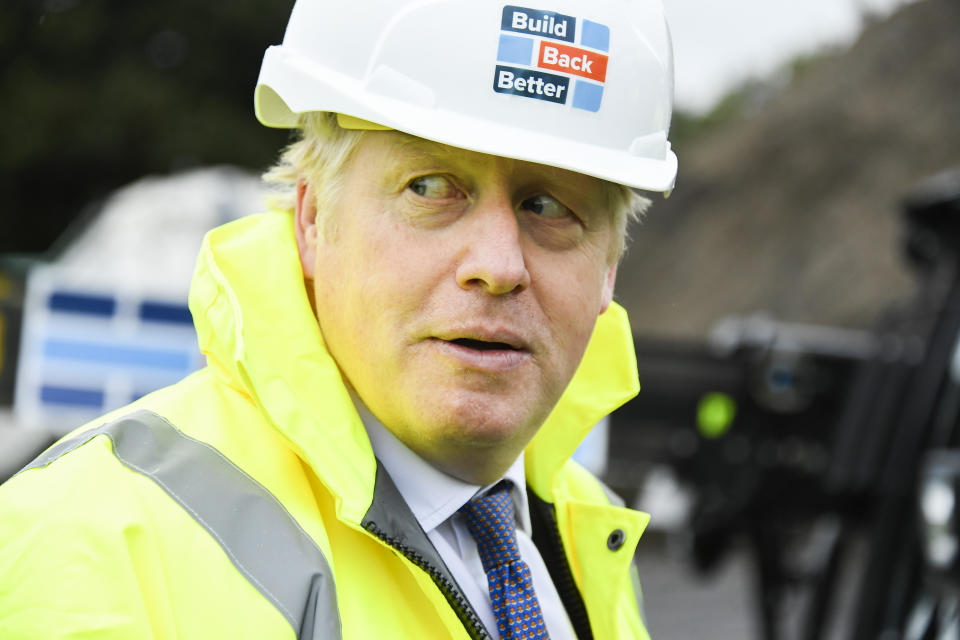 Britain's Prime Minister Boris Johnson visits the Conway Heathrow Asphalt & Recycling Plant construction site in west London, Saturday, Oct. 3, 2020. (AP Photo/Alberto Pezzali)