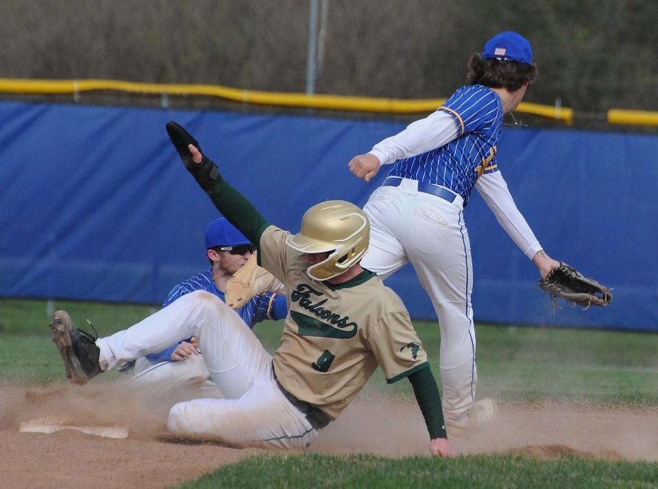 St. Mary Catholic Central's Nolan Moore steals second base at the throw got past Jefferson second baseman Joey Neckel and short stop Jase Johns Wednesday. SMCC won 11-2.