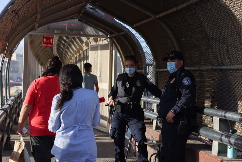 People walk into the United States from Ciudad Juarez, Mexico, in El Paso