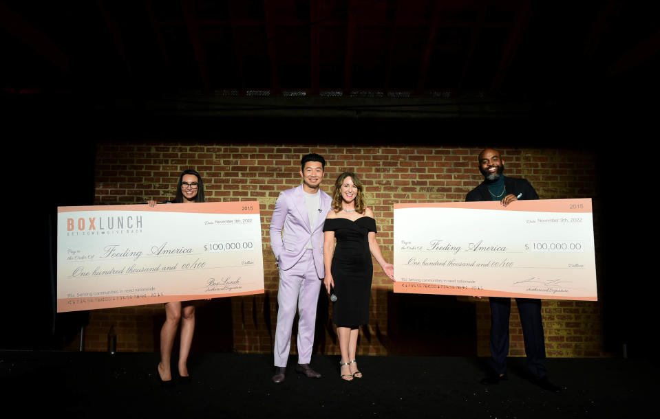 Simu Liu poses with Feeding America’s Casey Marsh at the BoxLunch gala honoring Feeding America.