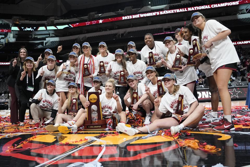 Transylvania players celebrate after winning the NCAA Women's Division 3 championship basketball game against Christopher Newport Saturday, April 1, 2023, in Dallas.(AP Photo/Darron Cummings)